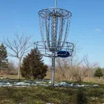 disc golf basket sky putter